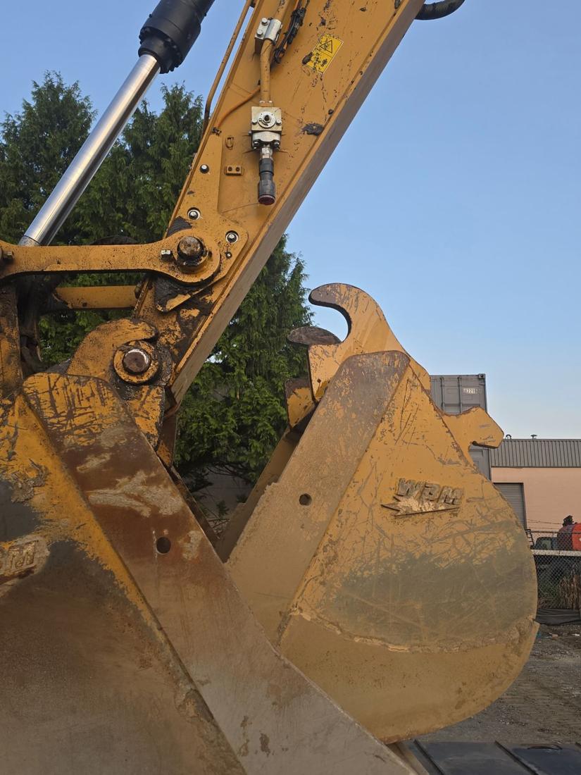 Close-up of an excavator bucket and arm
